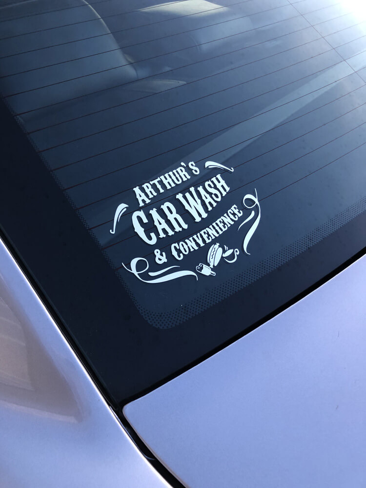 Arthur's Car Wash decal in car window